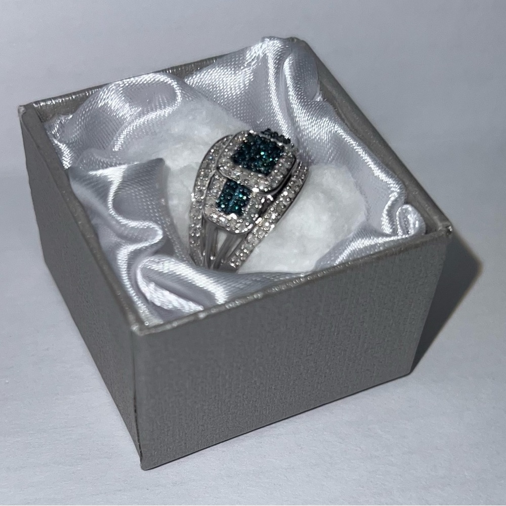 Blue diamond, white diamond in platinum over sterling silver ring